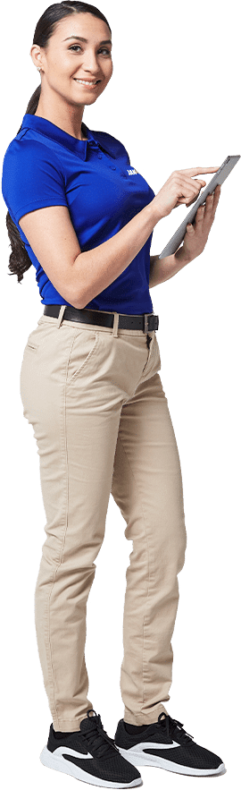 a woman JAN-PRO Cleaning & Disinfecting employee holding a tablet smiling