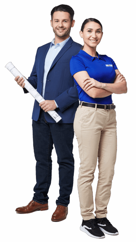 A woman JAN-PRO Cleaning & Disinfecting employee posing with a businessman holding plans rolled up